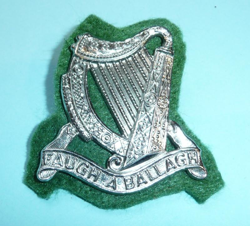 South African Irish Regiment Chromed Headdress Badge on Green Felt Badge Backing